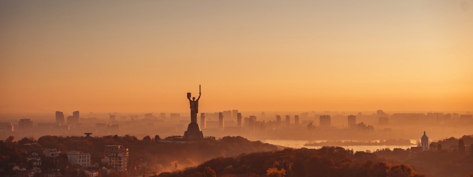 Mother Motherland monument, facing the sun. In Kiev, Ukraine.